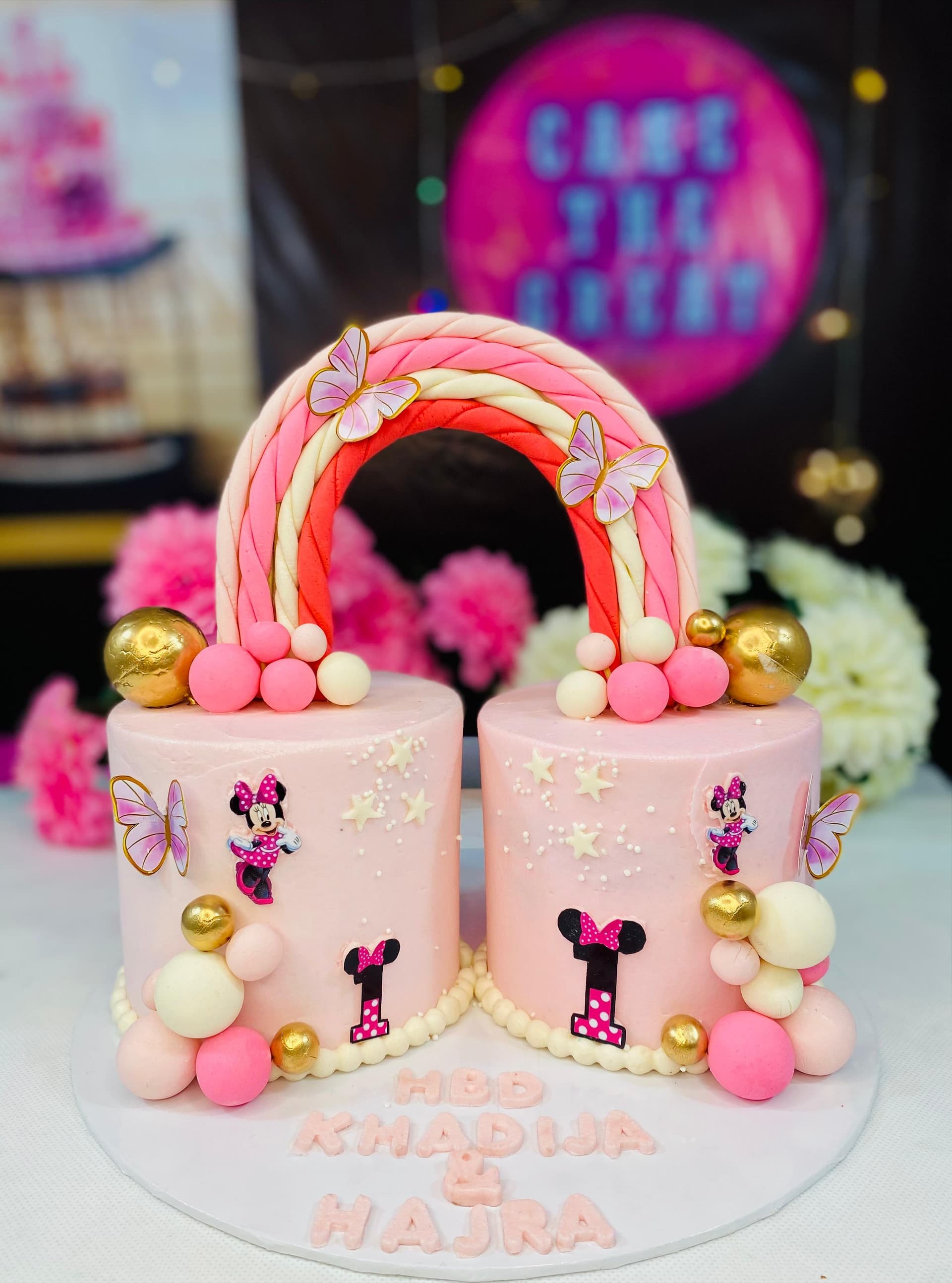 Twin Girls' Birthday Cake with Rainbow Arch